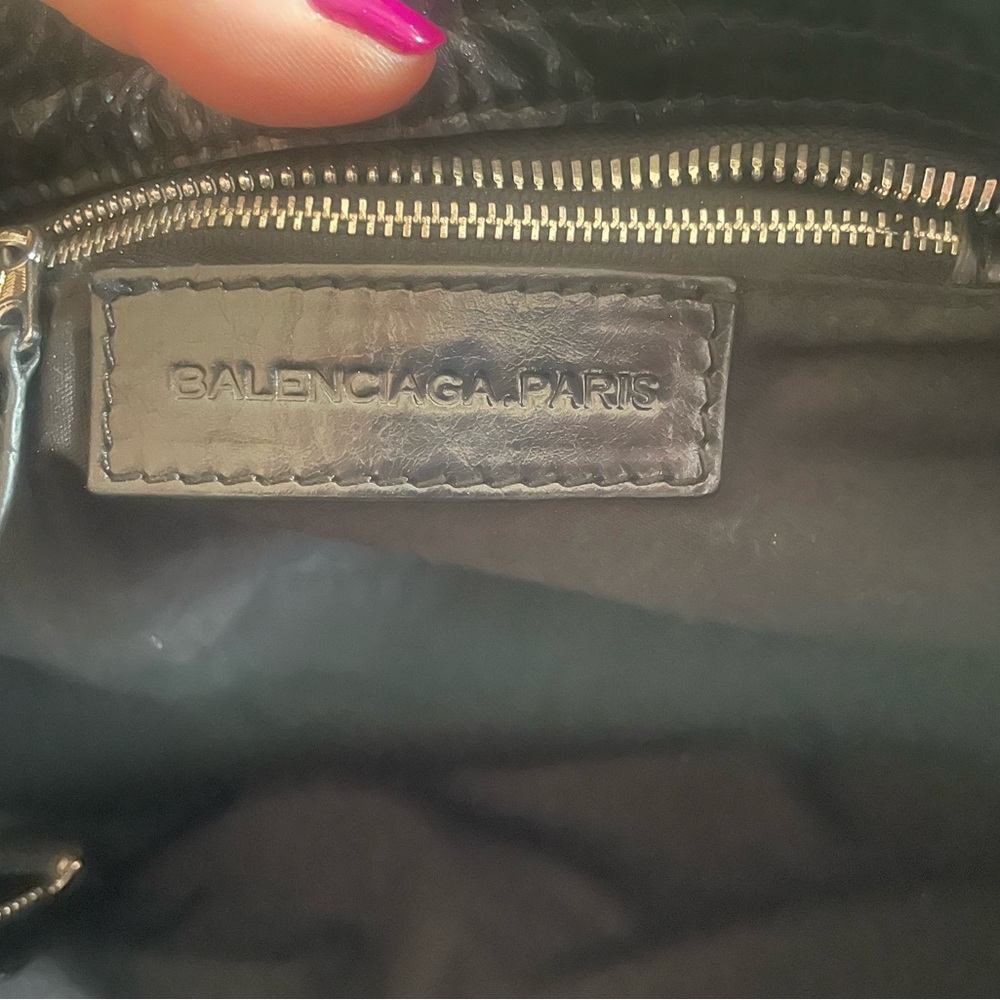 This classic Balenciaga black bag can be dressed up or down.